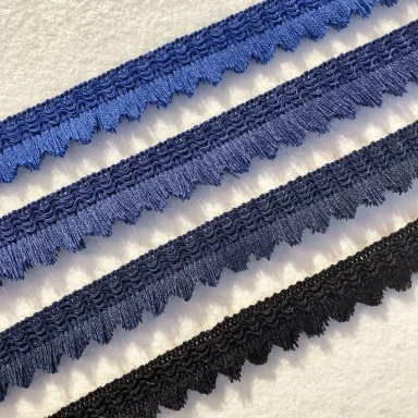 Traditionelle Besenlitzen in verschiedenen Farben